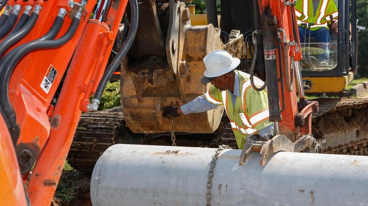 A crew from the Rock Hill Department of Public Works lays a new storm drain on a utility infrastructure improvement project on Haggins Street.