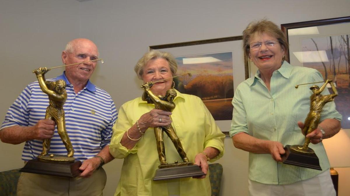 
Whitey Adams, from left, Betty Jo Rhea and Lucille Ray hold the trophies that bear their names to be given to the winners of the York, Chester and Lancaster county golf tournament being held to benefit the York County Free Medical Clinic. 
