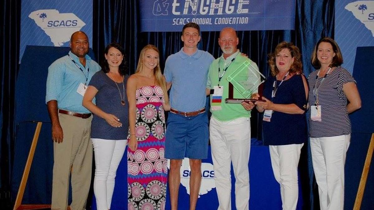 From left to right, Forrest Lawson, Jessica Lawson, Audrey Martin, Garrett Crenshaw, Hal Crenshaw, Tami Crenshaw and Brittany McCutcheon pose for a photo. Hal Crenshaw is the owner of Crenco Food Stores, Inc., a family-owned convenience store business which was recently named the 2017 South Carolina Retailer of the Year, by the South Carolina Association of Convenience Stores (SCACS) at the association’s annual convention.