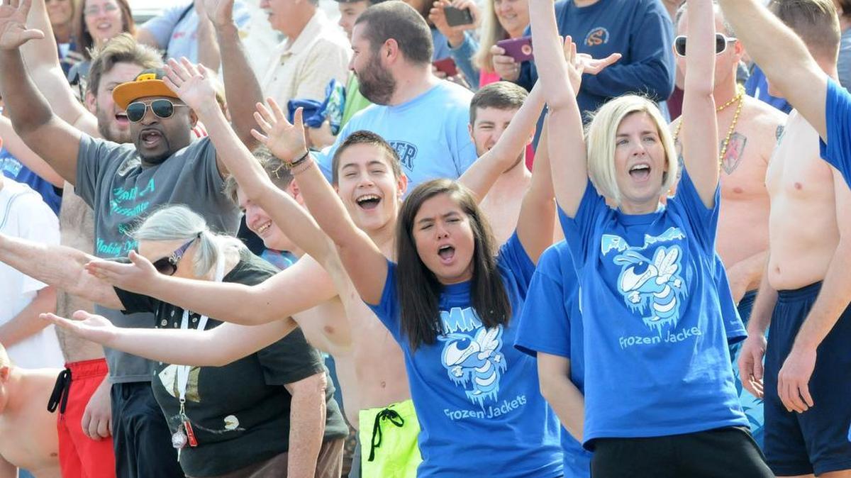 Participants at the Frozen Fans Polar Plunge cheer Saturday before running into the cold Lake Wylie water. The fundraiser benefits the Area 11 Special Olympics, which includes York, Chester and Lancaster counties.