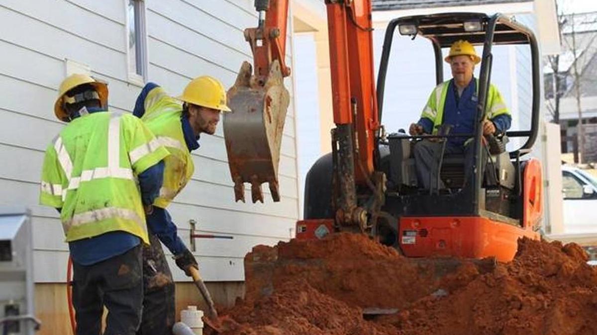 Workers dig on a Fort Mill construction site in Feb. 2016.