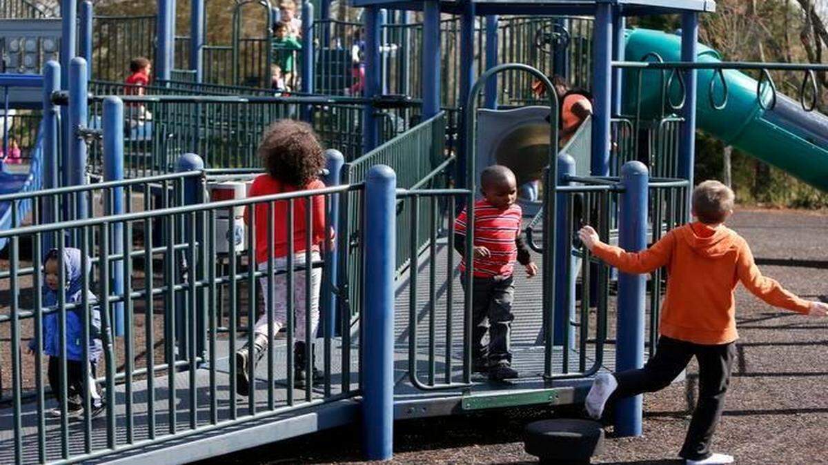 
Children enjoy the spring weather as they play at the Manchester Meadows playground in Rock Hill on Monday. 
