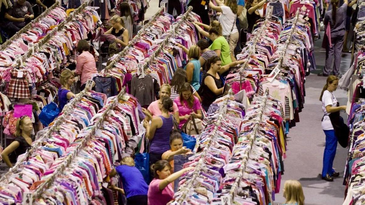 Shoppers look through aisles of clothing at the Upscale Weesale consignment event in Fort Mill.
