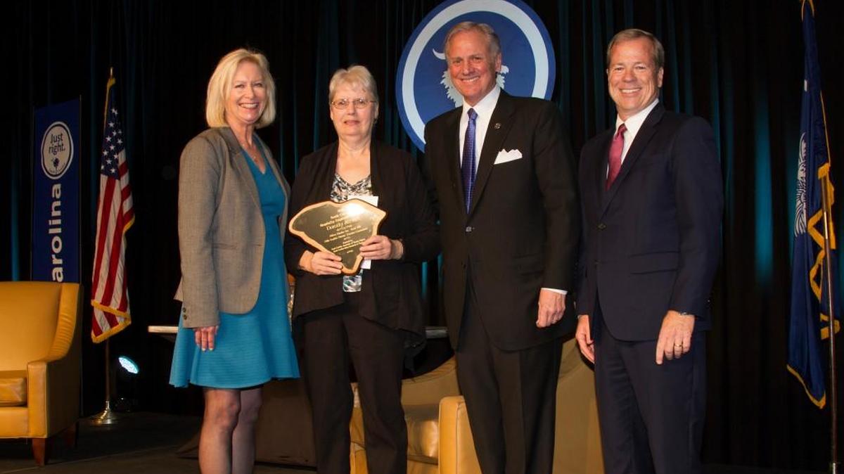 Dorothy Stewart (second from left) holds the award for S.C. Hospitality Employee of the Year at the 2017 Governors Conference on Tourism and Marketing.