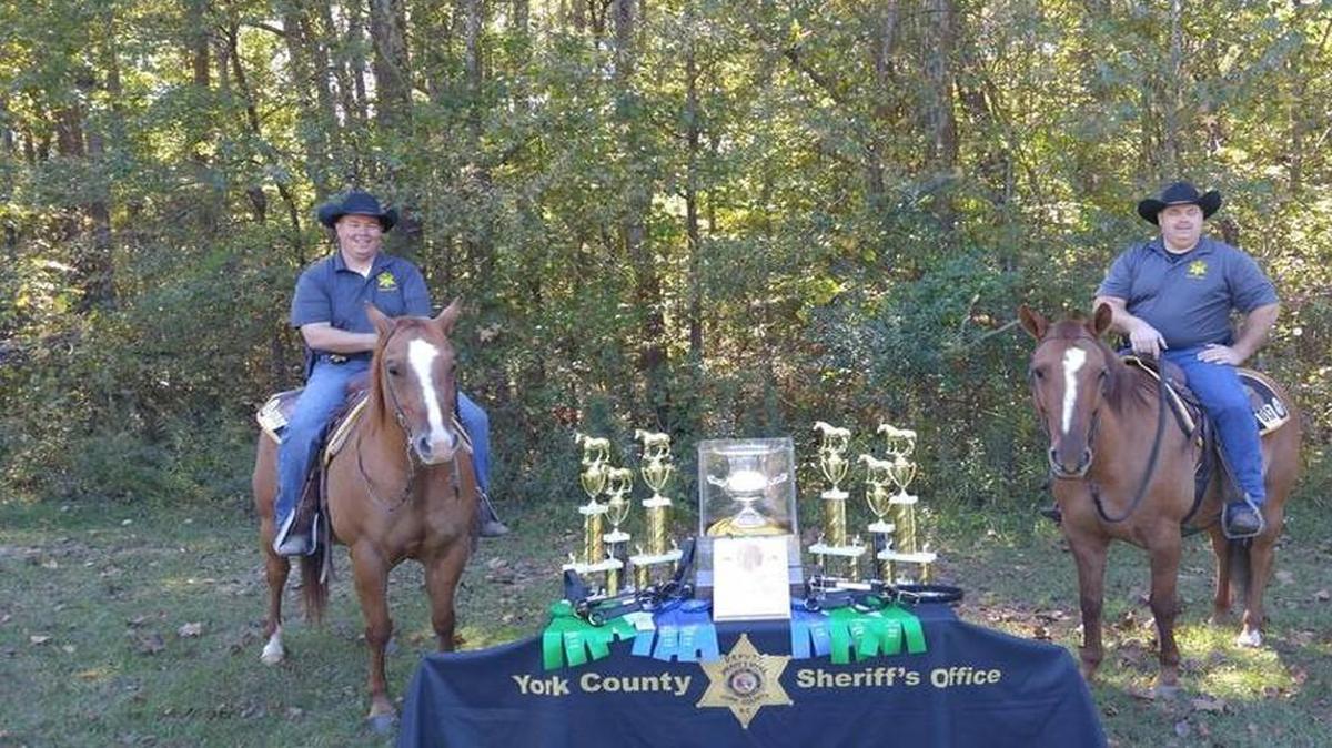 York County Sheriff’s deputies Mark McCarter and Jamie Sandifer pose with their horses Cochise and Barney. They competed against 44 officer and horse teams last year at the North America Police Equestrian Championships in Lexington, Ky.