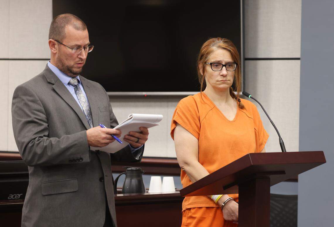 Defense attorney Thomas Bowen talks during court Thursday next to his client, Lisa Buza Hill.