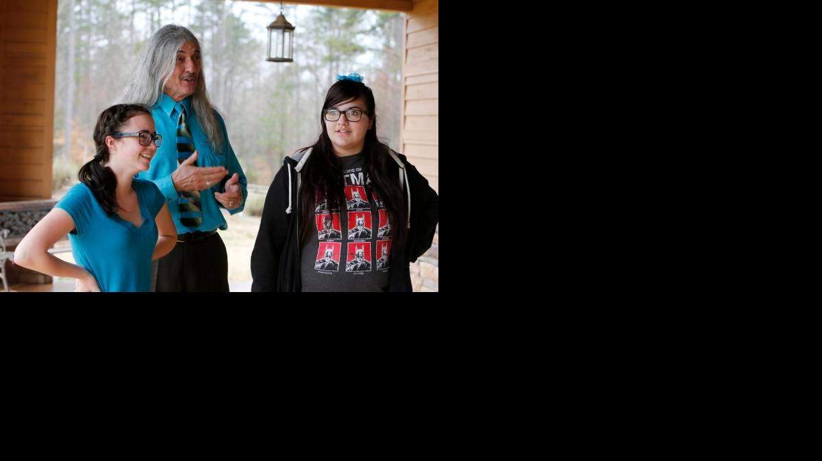 
Courtney Oates, 14, left, and Sarah Tucker, 15, right, were two of several Catawba Indian youth who saw President Obama when he spoke in Columbia. Catawba Indian Chief Bill Harris talks with the students about the trip to Columbia. 
