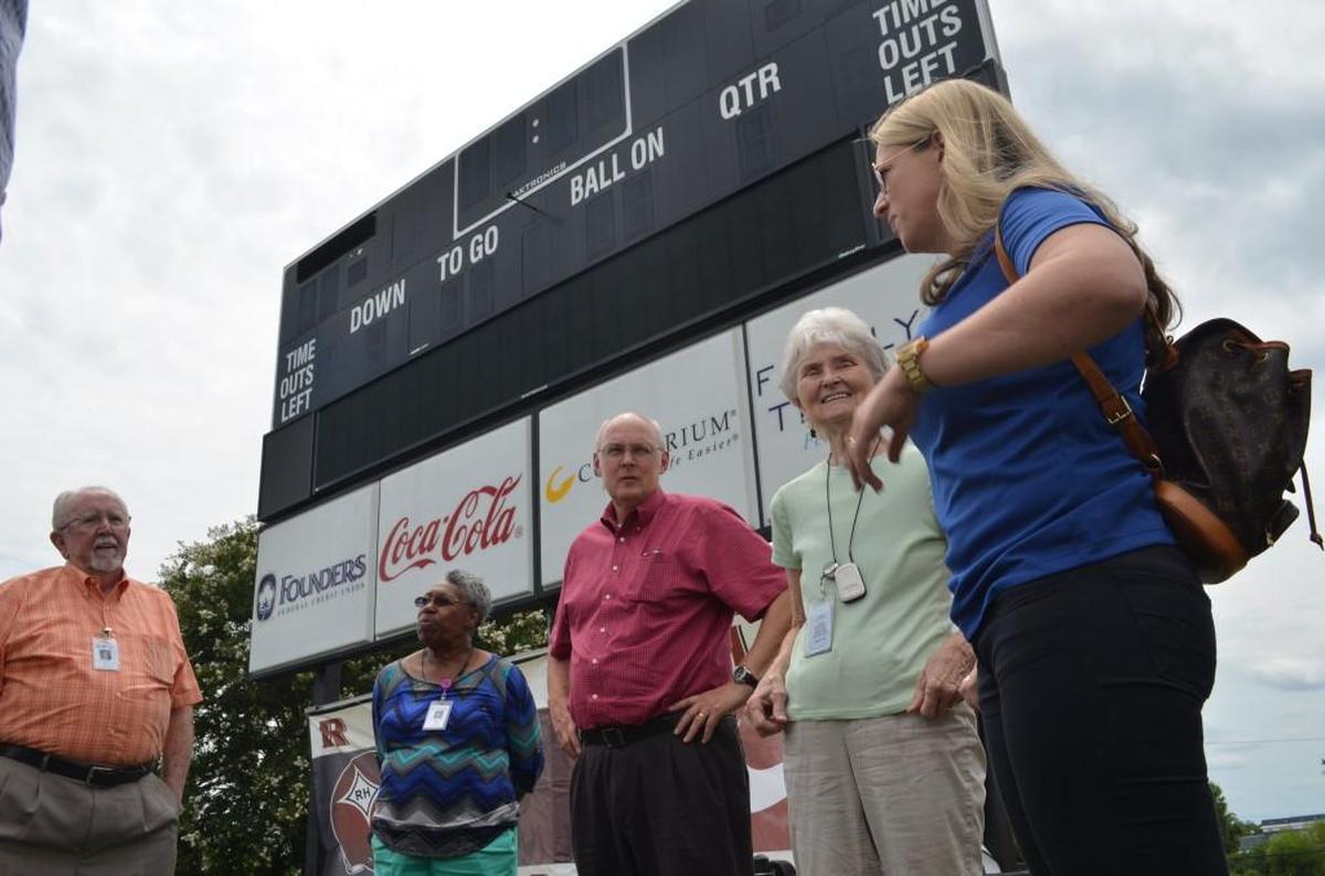 Rock Hill School Board members Walter Brown, Ann Reid, Jim Vining, Jane Sharp and Helena Miller discuss Friday’s tour of athletic facilities during a stop at District Three Stadium. 