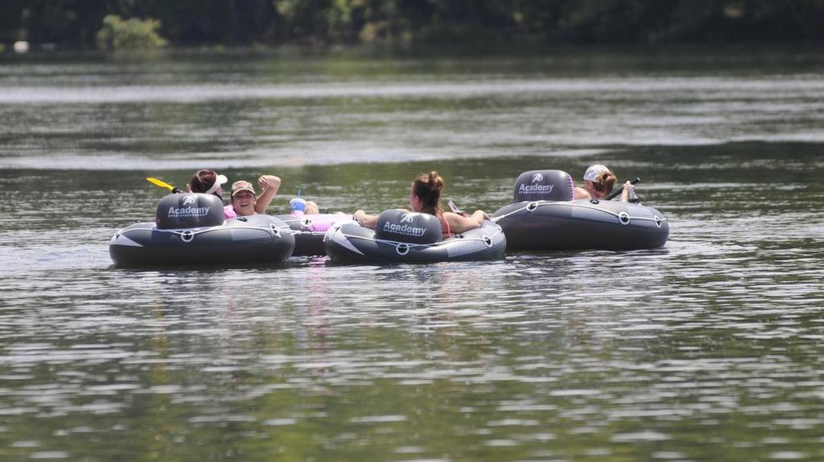 Tubers float down the Catawba River near Riverwalk on Saturday.