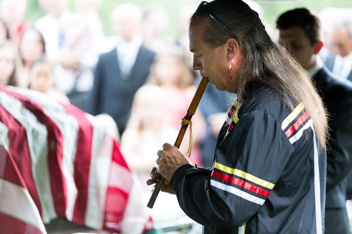 Monty Branham plays “Iswa” on his river cane flute at the 2016 burial of former Catawba Indian Chief Gilbert Blue on the tribe’s eastern York County reservation.
