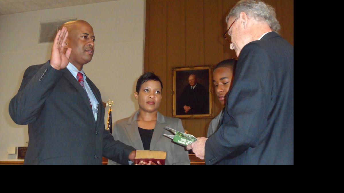 
Angel Underwood, center, with her husband as he was sworn in as Chester County sheriff after his 2012 election.
