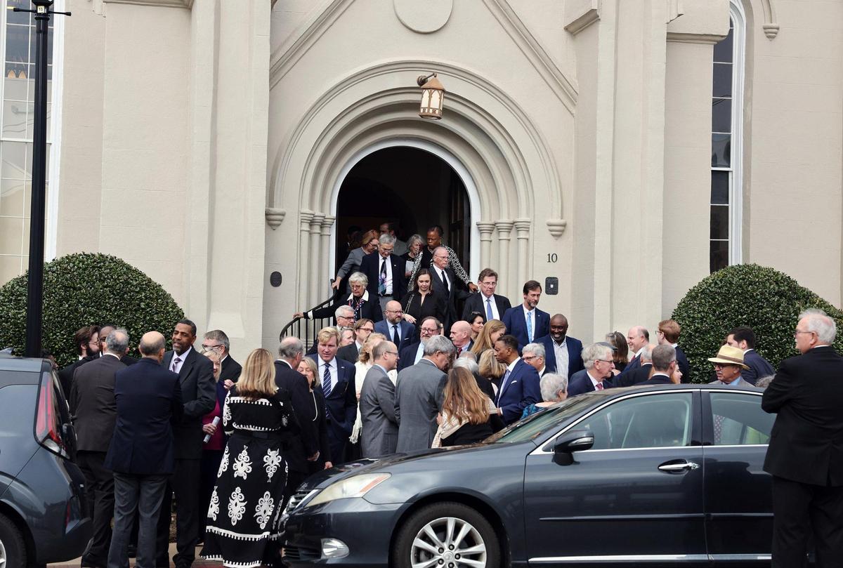 Dozens of people at John Spratt’s funeral leave the sanctuary at First Presbyterian Church in York Wednesday.