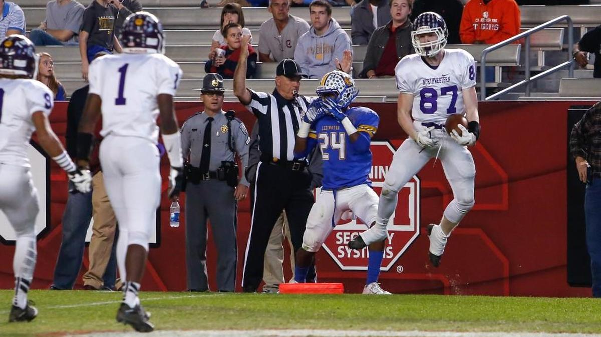 Northwestern’s Tyler Morgan celebrates after scoring the Trojans’ first score of the game.