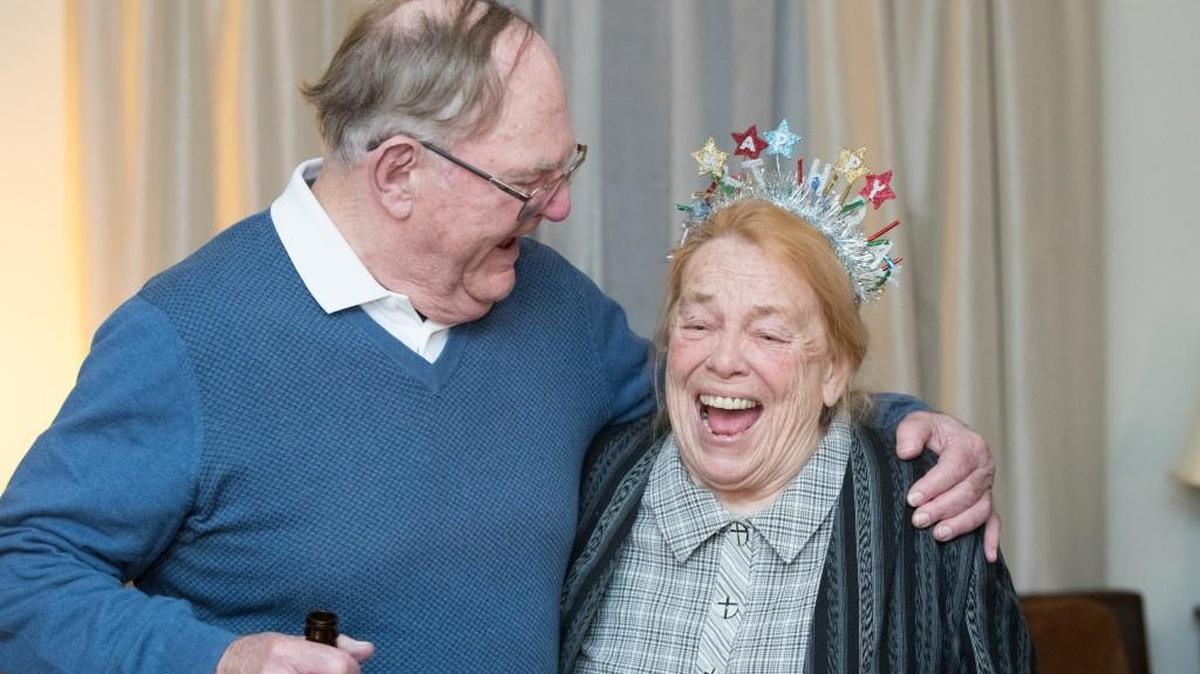 Joyce McClendon Evans talked with long-time friend Jim Hanlon. who traveled from Princeton, N.J. to celebrate her 80th birthday in Midway, Ky.