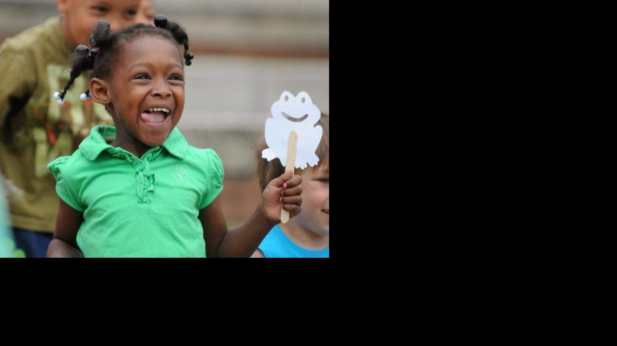 
Cayden White, 5, participates with other children in activities during Leap into Literacy at the Rock Hill City Hall Amphitheater as part of Come-See-Me.
