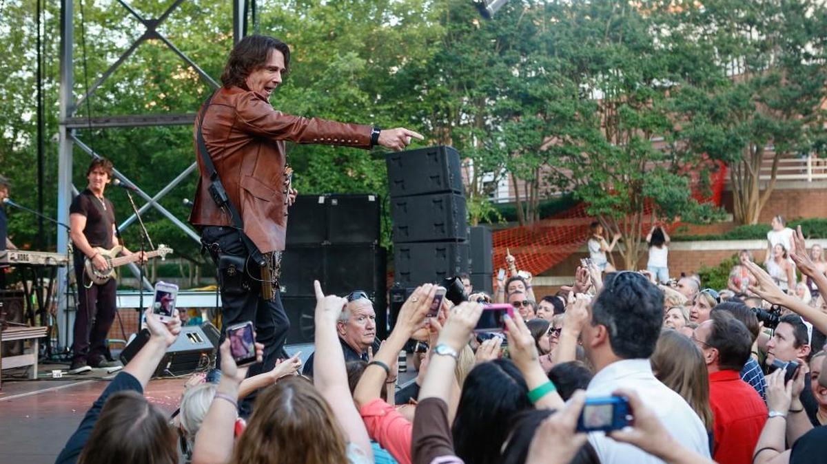 Rick Springfield connects with a fan as he performed in June 2013 during a sold out show at the Old Town Amphitheater in Rock Hill in this file photo. Springfield returns in June 2018 to the same venue.