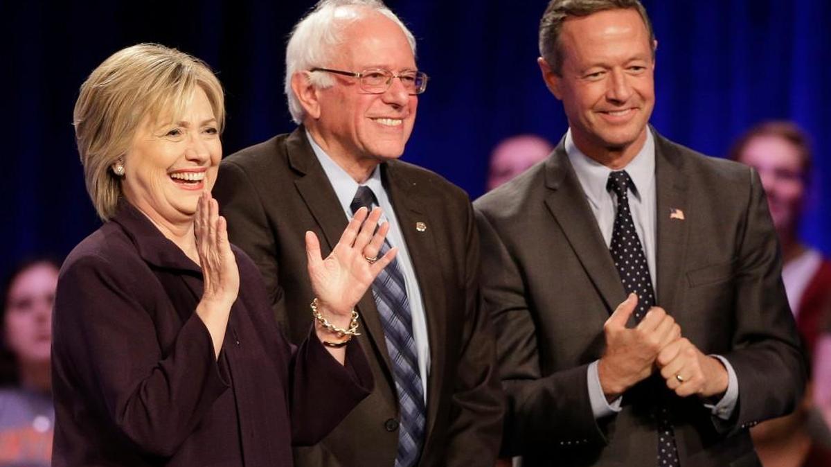 Democratic presidential candidates Hillary Rodham Clinton, former Maryland Gov. Martin O'Malley, right, and Sen. Bernie Sanders, I-Vt, smile after a Democratic presidential candidate forum at Winthrop University in Rock Hill on Friday.