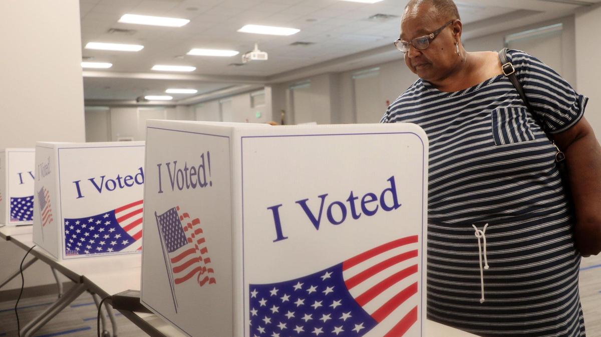 Gloria Robinson votes Tuesday at the Rock Hill School District office.