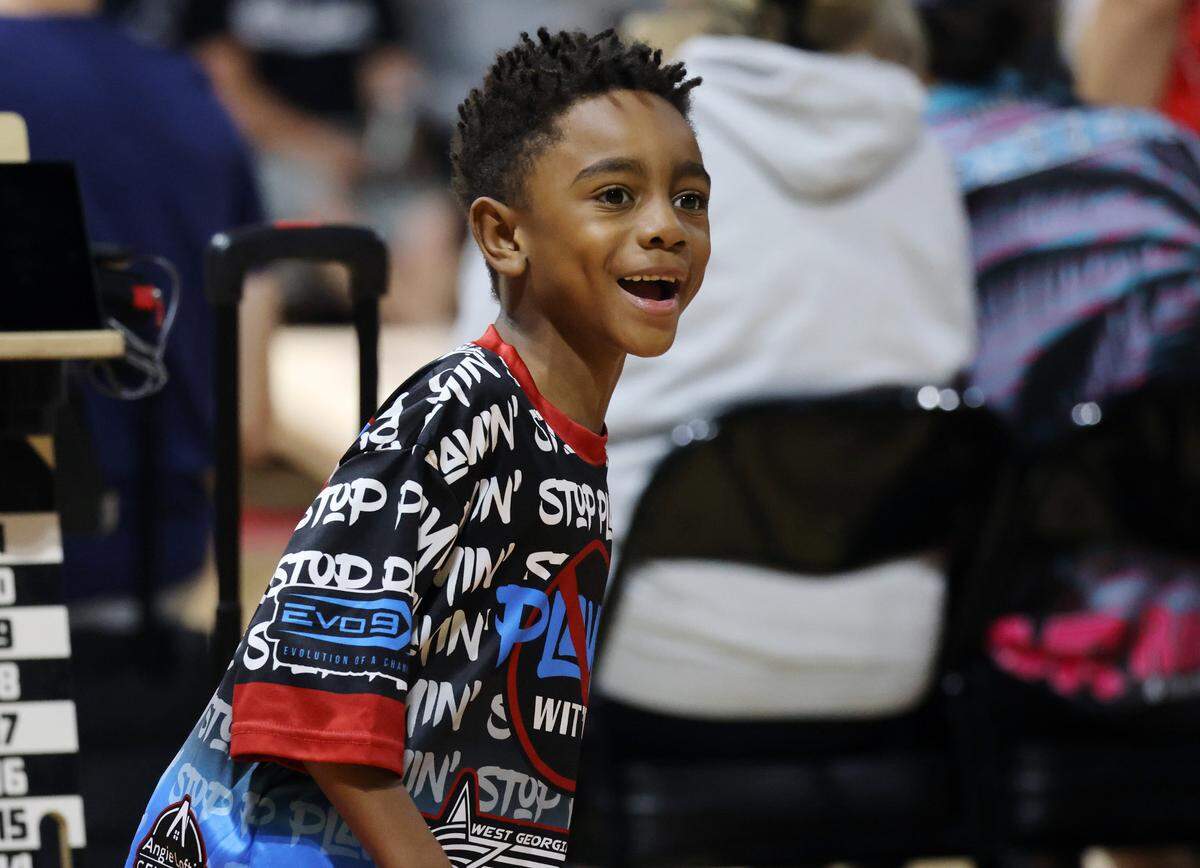 7-year-old Carter Warner gets excited during a game of cornhole Friday at the American Cornhole League World Championships in Rock Hill, S.C.