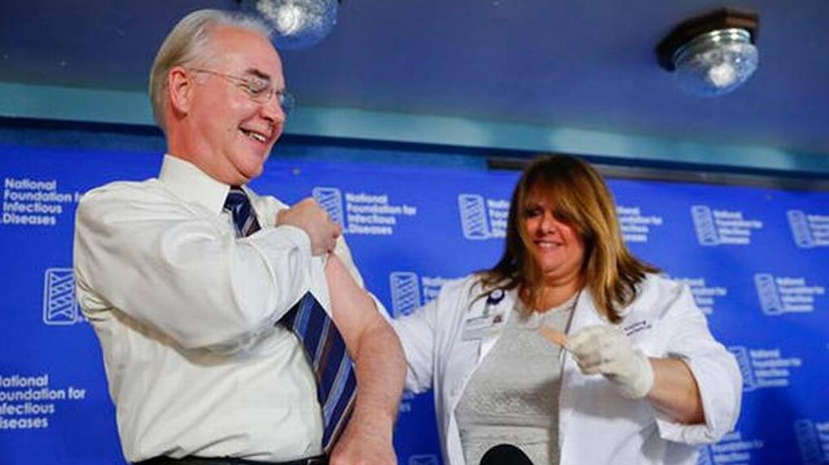 Health and Human Services Secretary Tom Price, left, received a flu vaccination from Sharon Walsh-Bonadies, RN., right during a news conference recommending everyone age six months and older be vaccinated against influenza each year.