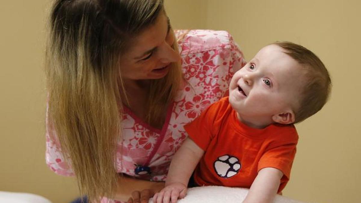 
Triton Ayers receives physical therapy from Carrie Tomeck at Piedmont Medical Center in Rock Hill.
