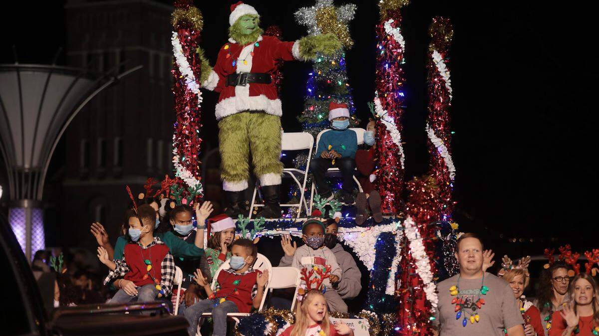 The Grinch and a float of children make their way down Main Street in Rock Hill Friday for the annual Christmas parade.