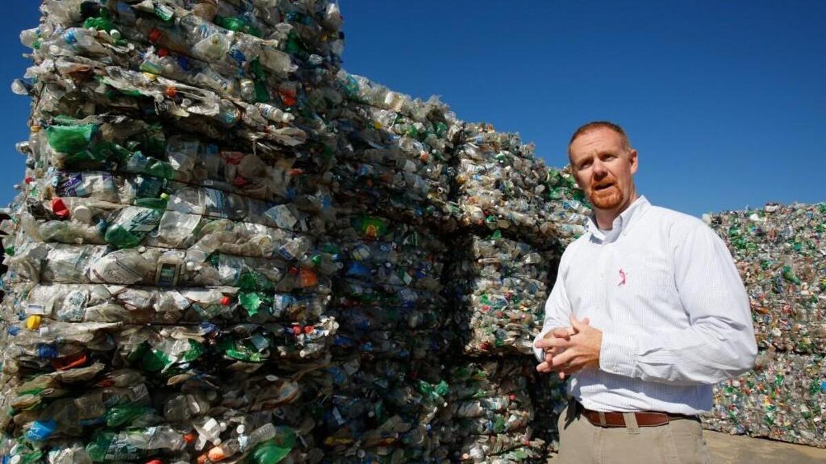 Eric Rekitt, York County Assistant Public Works Director, stands next to bales of plastic soda bottles at The York County Public Works Recycling Center in York.