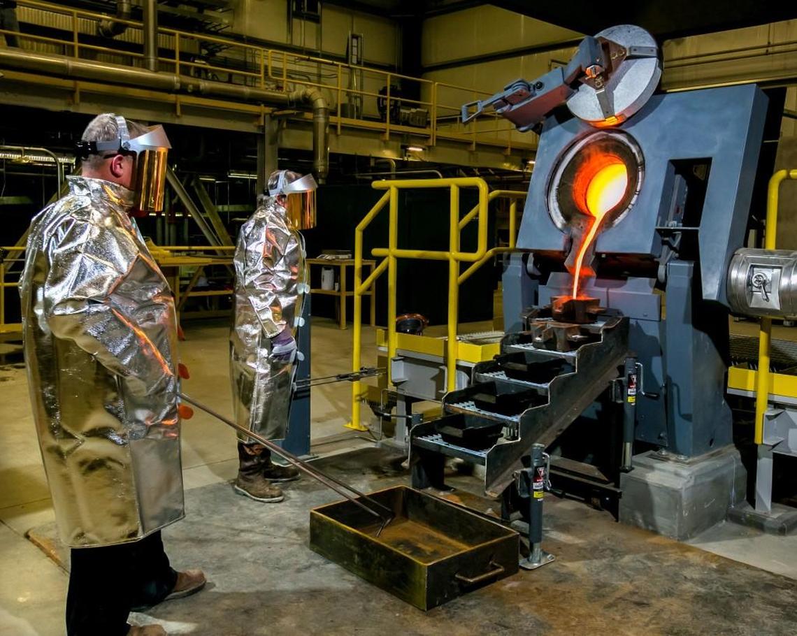 In this file photo, members of OceanasGold’s Haile metallurgical team oversees the pouring of molten gold. The Haile Gold Mine is located in Lancaster County.