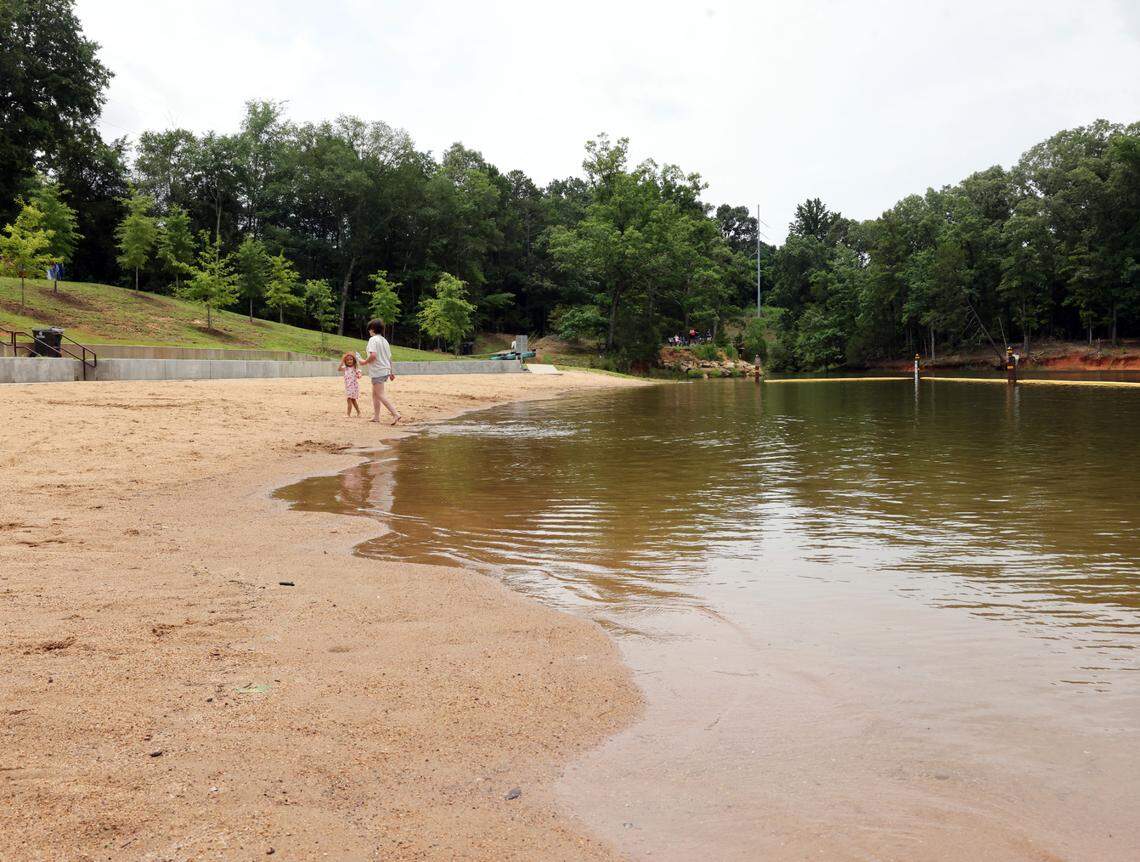 Children play at the beach at Rock Hill Lake Park on a recent Saturday. The park joins Ebenezer Park to provide public swimming areas on Lake Wylie.