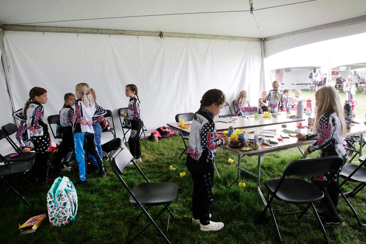 Team USA girls in the 8-year-olds division play with Playdough and other toys Monday before racing in Rock Hill.