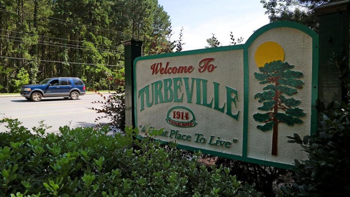 Cars drive past the welcome sign in Turbeville. Brett Bursey, director of the South Carolina Progressive network, has joined a lawsuit against the small town for writing municipal traffic tickets he claims are unconstitutional.