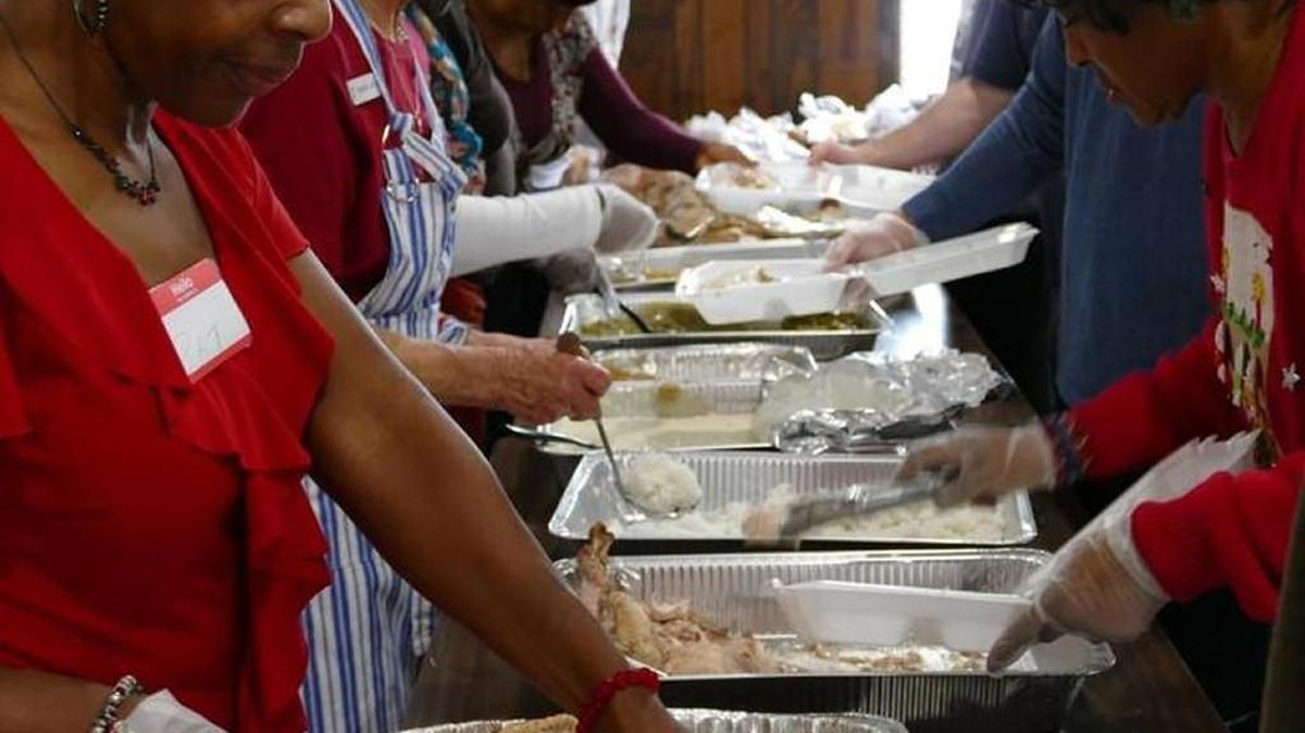 Volunteers from several churches serve a pre-Christmas meal put on by several Rock Hill churches in 2015.