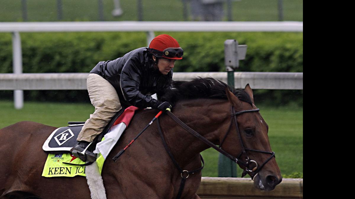 
Kentucky Derby hopeful Keen Ice is put through a morning workout by jockey Tammy Fox from trainer Dale Romans at Churchill Downs in Louisville, Ky., on April 25. 
