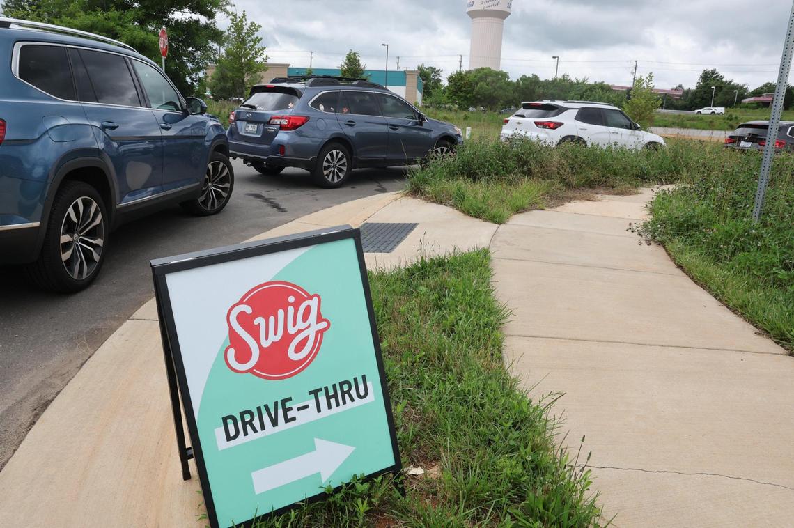 Cars line Worldreach Drive behind Swig, a popular new drink shop in Indian Land. TikTok and reality television are two reasons Swig, new to the Carolinas with the Indian Land store, is off to a busy start.