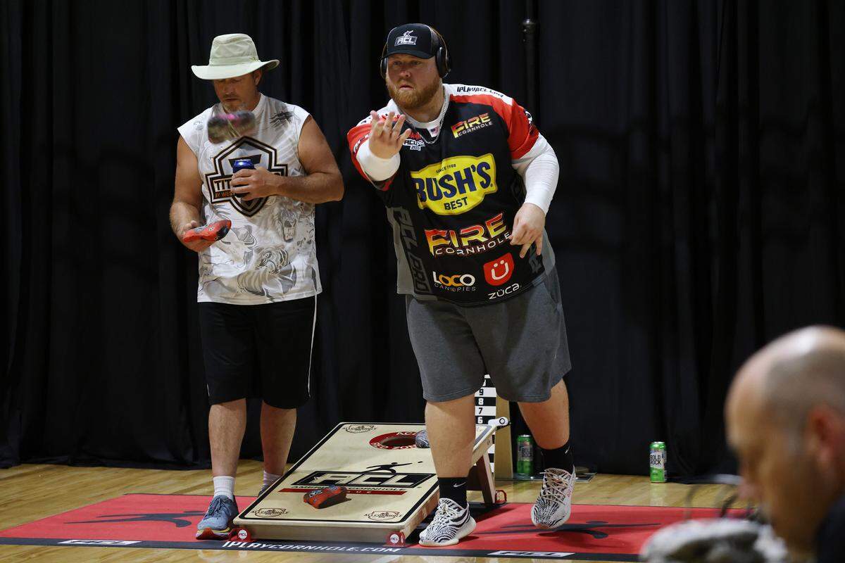 Adam Hissner, left, and Jamie Graham play a game of cornhole Friday at the American Cornhole Championships in Rock Hill, S.C.