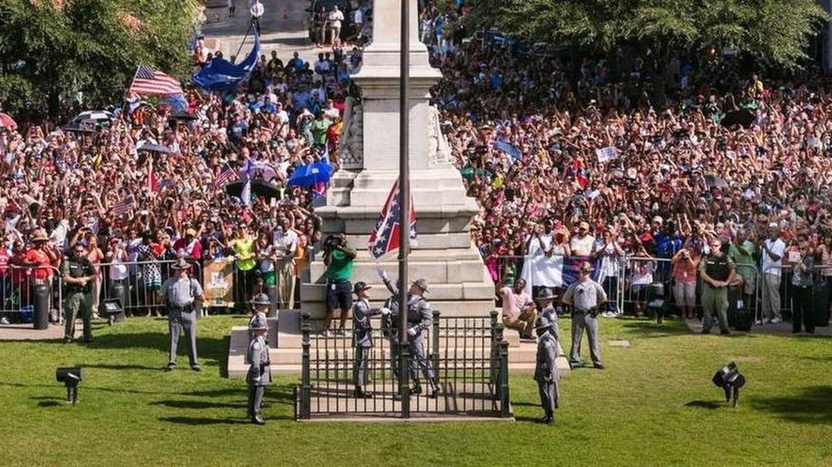 S.C. Highway Patrol Honor Guard members take down the Confederate battle flag from the State House grounds for the final time during a ceremony last July 10.