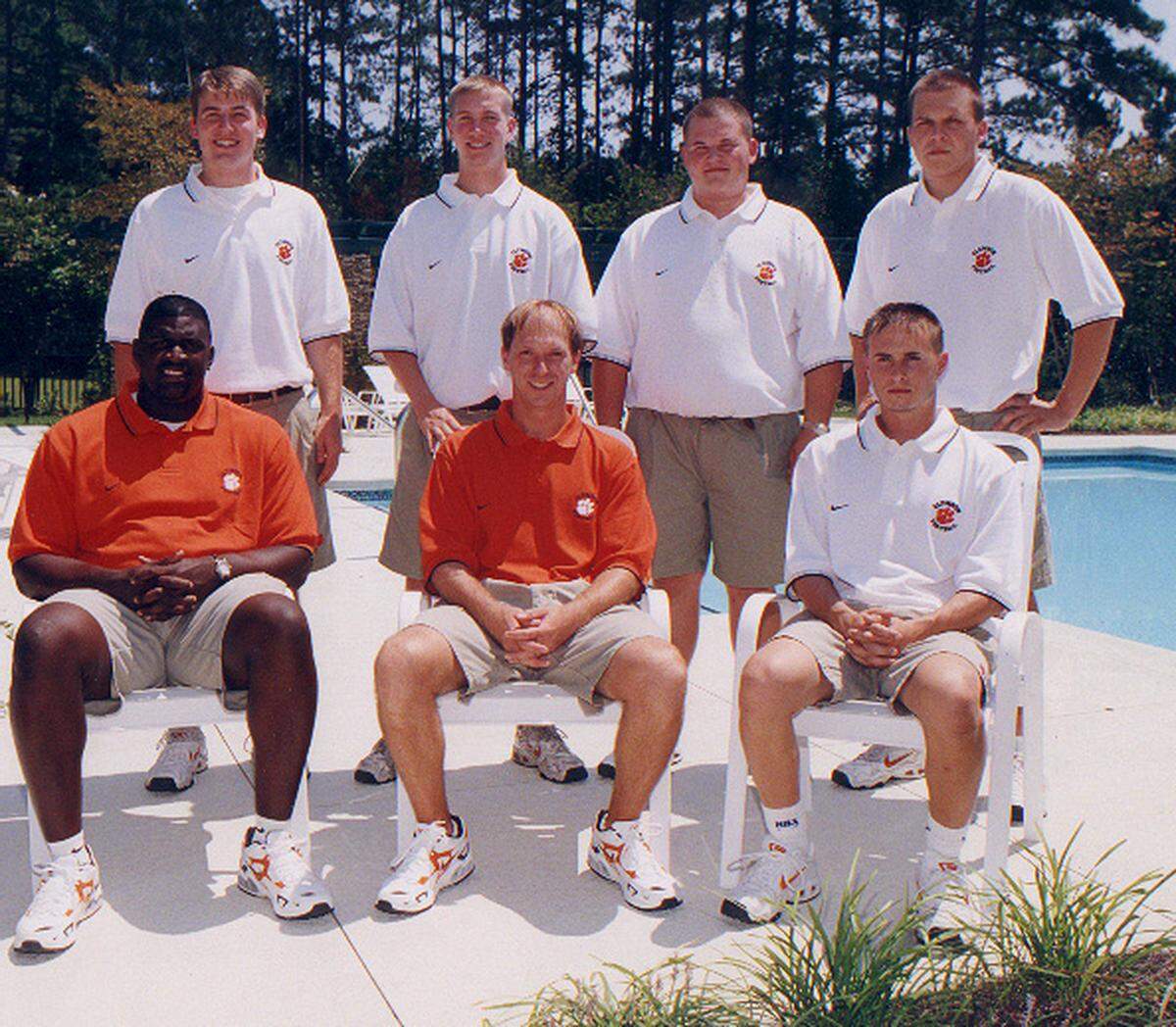 Brett Ringer (far right, white shirt, sitting) served as a member of Clemson’s video technology department while pursuing his master’s degree there. His former boss, Rick Bagby (middle, orange shirt, sitting), said that Brett’s work ethic was one of his most memorable qualities.