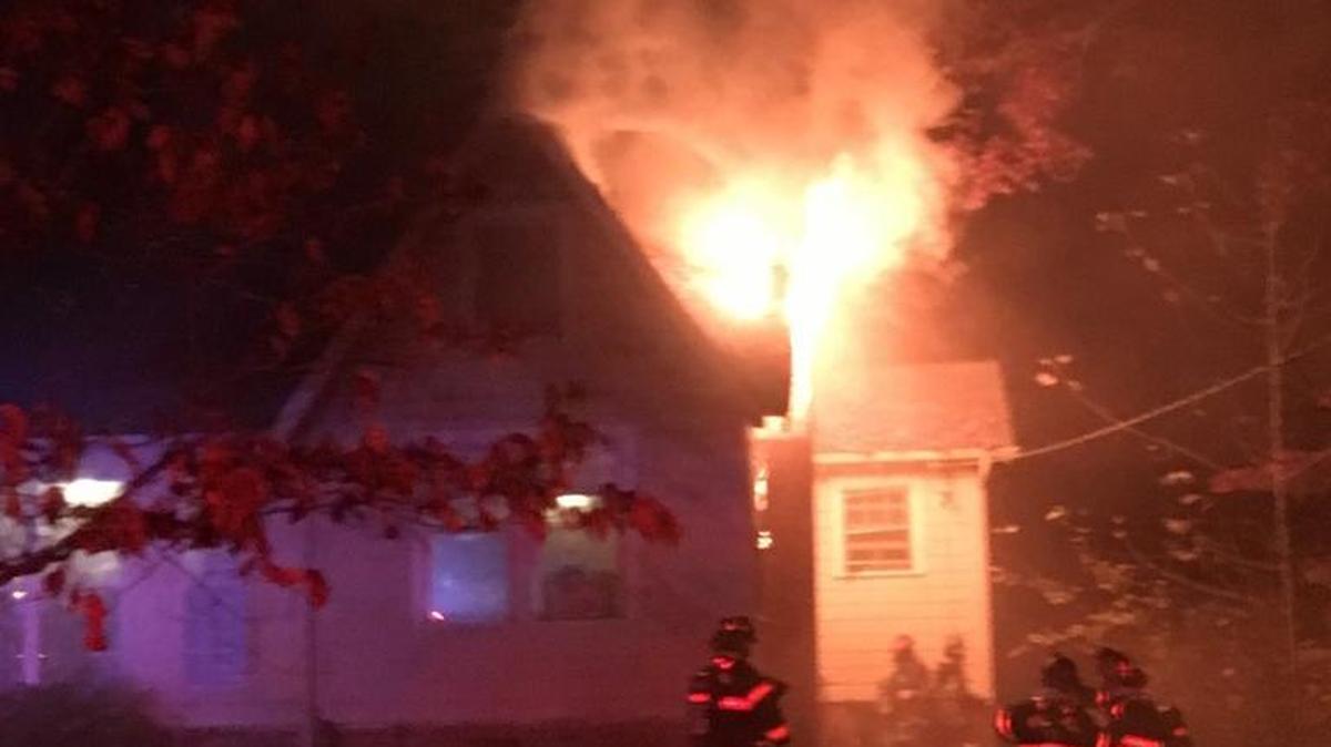 Rock Hill firefighters battle a house fire at 903 Annafrel St. Tuesday night. The one resident inside escaped unharmed but two people are displaced after the fire caused “heavy damage” to the home, fire officials said.