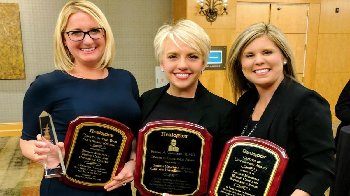 Springs Memorial Wound Care & Hyperbaric Center Dr. Jaime Wise, medical director; Karen Scott, program director; and Meredith Starnes, clinical coordinator, hold awards they were honored with.