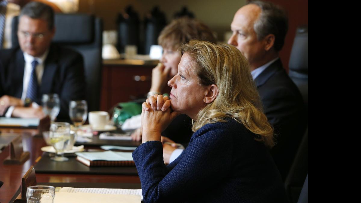 
Winthrop President Jamie Comstock Williamson listens as the Board of Trustees votes to fire her in July 2014.
