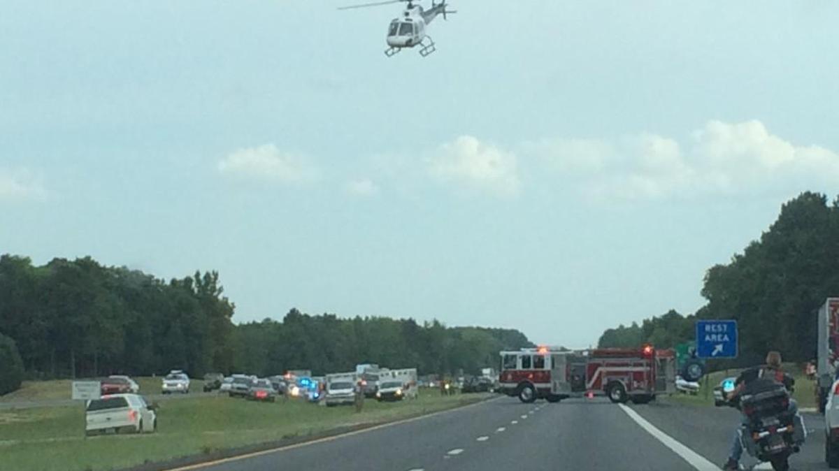A helicopter lands on Interstate 77 in Chester County on July 12. Two choppers were needed to fly out two people who were severely burned when their motorcycle was struck by a car near S.C. 9. One victim, Teresa Miller of Edgemoor, later died from injuries suffered in the crash.