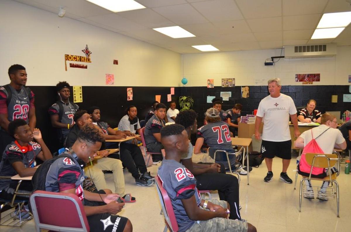 Members of the Bearcat defense pause during a team meeting Friday. Athletic officials want to turn this classroom in a training room for all athletic teams. 