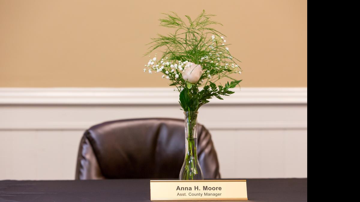 
A memorial is placed at the dias as the York County Council holds its first meeting since Assistant County Manager Anna Moore was slain July 5.
