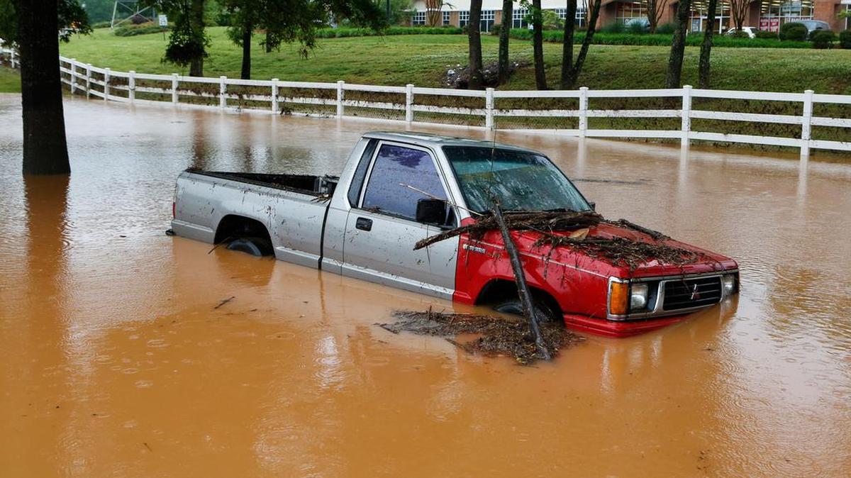 A pickup truck sits in deep water off Dave Lyle Boulevard after heavy rains Saturday brought flooding to Rock Hill.