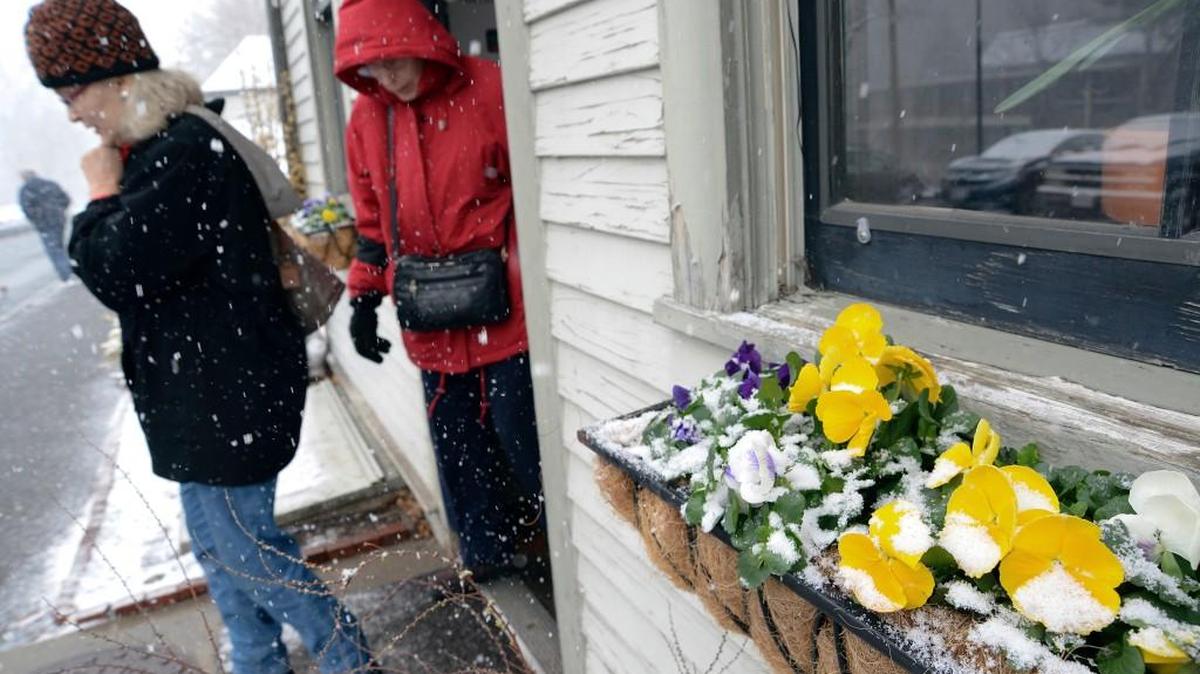 Ramona Flynn and Beverly Dudek, both of Westfield, Mass., exit the Mount Holyoke College Spring Flower Show at the Talcott Greenhouse on Friday, March 10, 2017, as snow falls. The Rock Hill area could see a light snowfall at daybreak Sunday, the first day of daylight saving time.