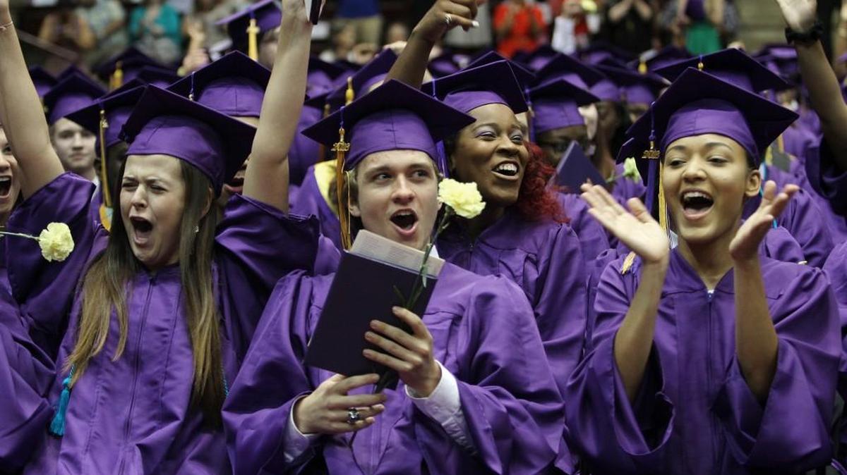 Northwestern High School graduates cheer Saturday at commencement.