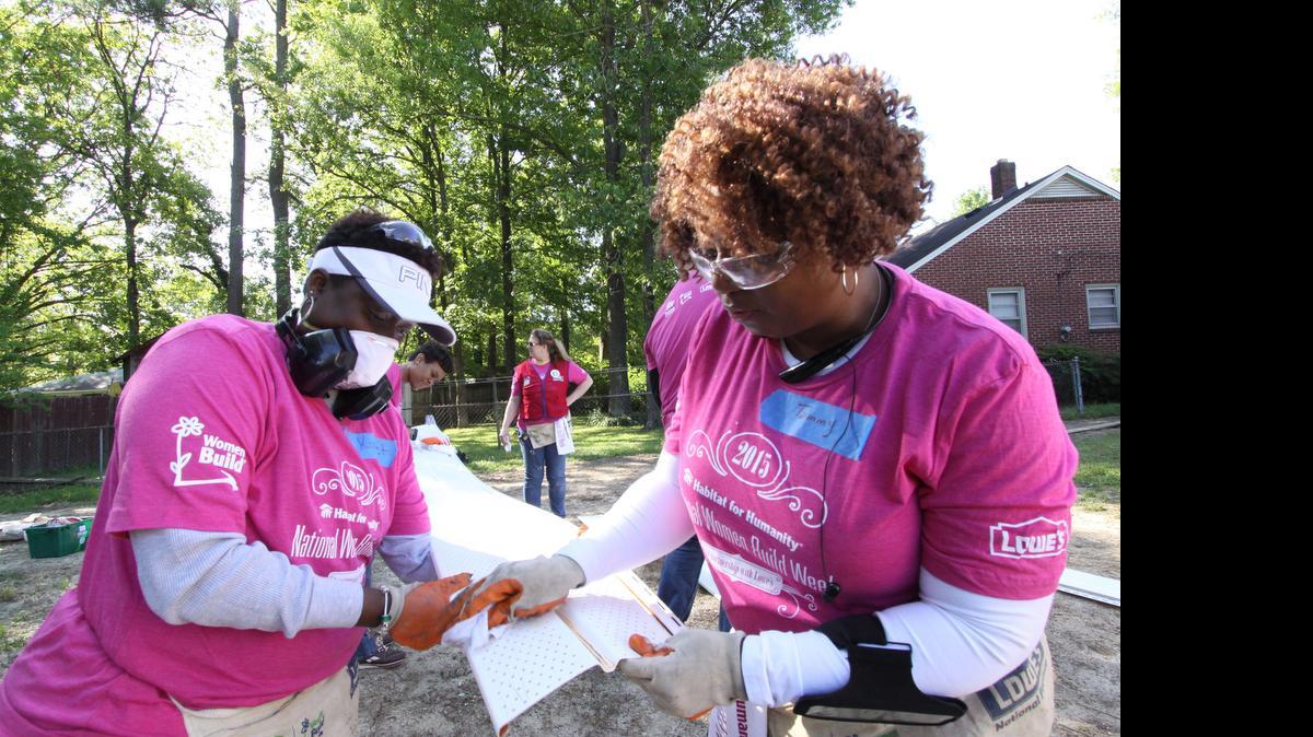 
Habitat for Humanity volunteers work on a house in Rock Hill on Saturday as part of National Women Build Week.
