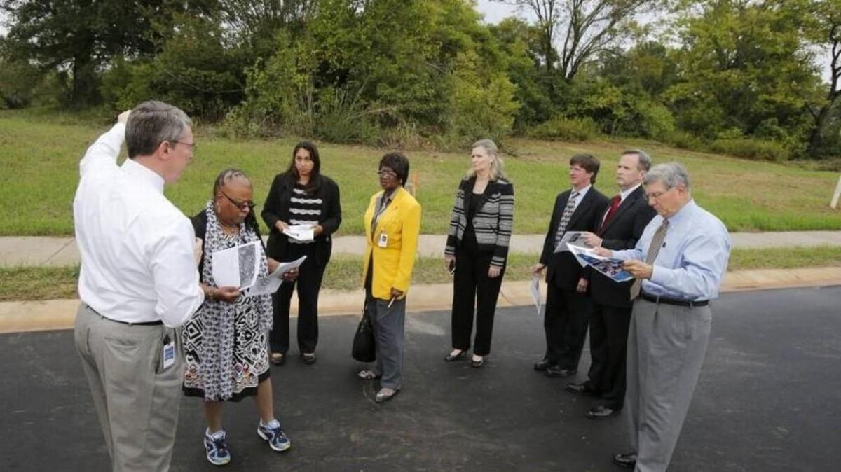 In this 2015 file photo, the Rock Hill City Council toured the Hagins-Fewell neighborhood to inspect some developments there. City Manager David Vehaun, left, and city employee Jennifer Wilford, third from left, joined council members, from left, Sandra Oborokumo, Ann Williamson, Kathy Pender, John Black, Jim Reno and Mayor Doug Echols.