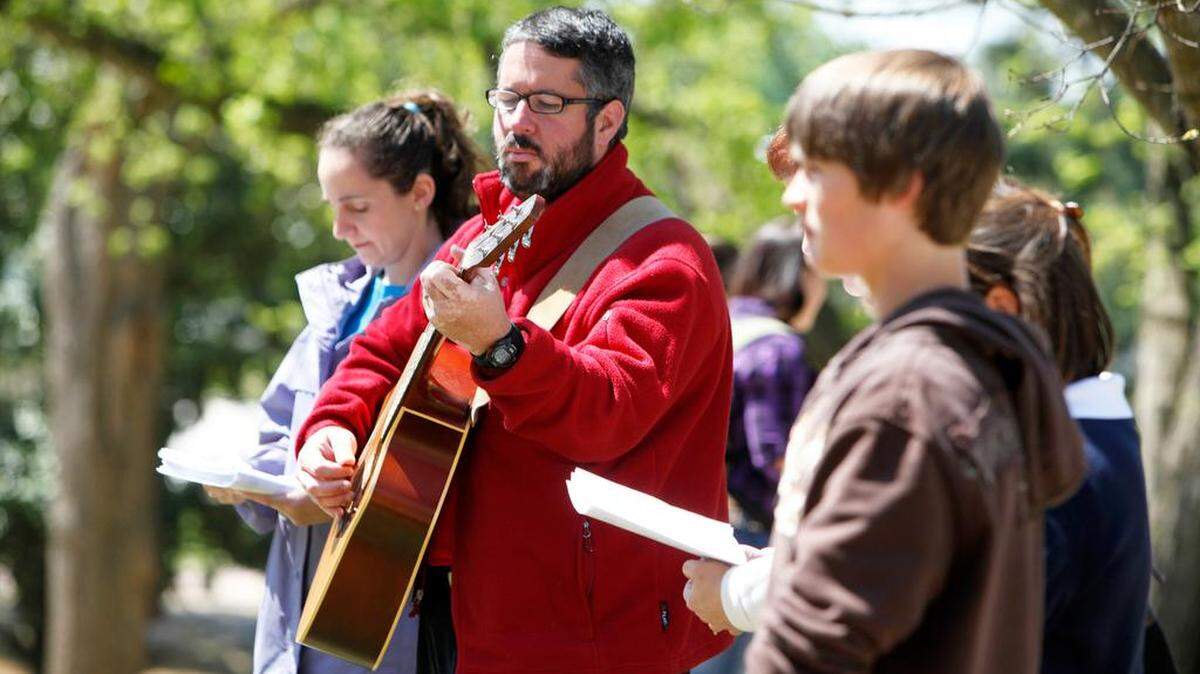 John O’Kain, associate pastor for campus and young adults at Oakland Presbyterian Church, plays guitar during A Good Friday Journey at Winthrop University sponsored by Winthrop Cooperative Campus Ministries Friday. __Photo by Andy Burriss