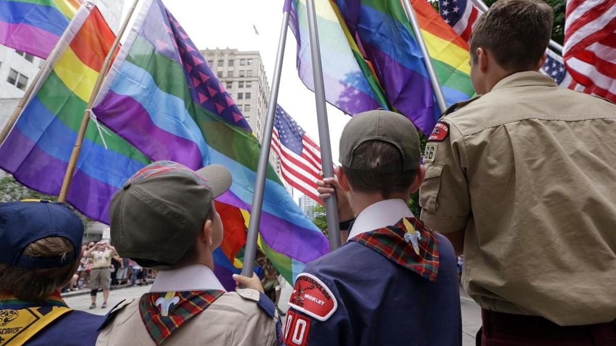 June 28, 2015 file photo of Cub Scouts and Boy Scouts preparing to lead marchers while waving rainbow-colored flags at the 41st annual Pride Parade in Seattle.